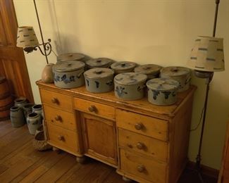 Early American crocks, small buffet, and vintage lamps