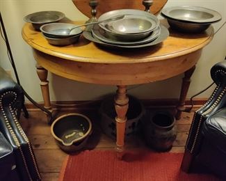 pewter bowls, 19th century pine half-round table, antique crocks