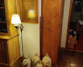 antique framed sampler, floor lamp, crocks