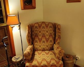 armchair, antique crocks, antique sampler