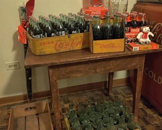 Antique Coca-Cola crates, full Coca-Cola bottles, empty Coca-Cola bottles