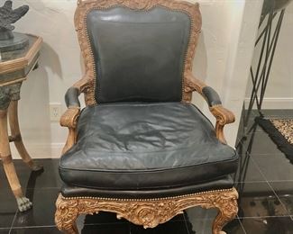 Pair of black leather Maitland Smith bergere chairs