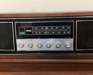 One of several pieces of vintage and contemporary electronics, including vinyl turntable