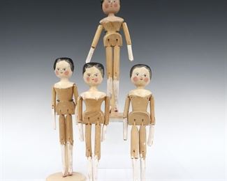 Four late 19th century Grodner "Dutch" dolls. Carved wooden dolls with pegged articulated limbs and painted detail. Some wear to painted decoration, wood with minor splits. Up to 12 1/2" long. ESTIMATE $100-200
