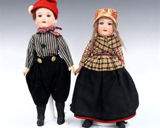 A pair of early 20th century Armand Marseille Model 390N dolls. Bisque socket heads with sleep eyes, open mouths with teeth and painted detail on jointed composite bodies. Includes a male and female wearing traditional Dutch clothing. Impressed "Germany 390N / A. 410 M." at necks. Slight wear to paint, fabric with minor fading. Each 14" high. ESTIMATE $50-100