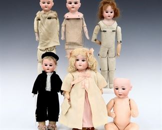 Six 19th and early 20th century dolls, mostly German. Bisque heads with painted detail on various bodies, five with sleep eyes and one with stationary eyes, includes four by Armand Marseille. Some with impressed maker's marks and numbers. Some wear and minor damage, fabric with fading and some stains. Up to 13 1/2" long. ESTIMATE $100-150
