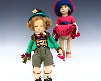 Two early 20th century felted wool dolls. Stuffed felt swivel heads with molded features and painted detail on articulated stuffed felt bodies. One Lenci with Mohair "Shirley Temple" hair, wearing traditional boy's Austrian clothing, the other Lenci type with curly hair wearing 1930's style girl's clothing. Some wear and discoloration, girl lacks one bootie, other is torn. Up to 19" high. ESTIMATE $200-300
