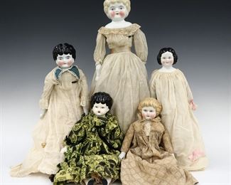 Five 19th to early 20th century dolls. China heads with molded hair and painted detail, on cloth jointed bodies with porcelain lower arms and legs with heeled boots. Includes three with painted Brown hair and two Blonde. Some wear to paint, fabric with some fading, staining and small holes, both blondes with detached legs. Up to 18" long. ESTIMATE $100-200