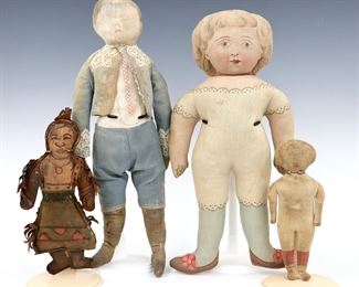 Four turn of the century cloth dolls with lithographed and hand-painted detail. Includes three "cut and sew" cotton dolls and a Native American leather souvenir doll signed "Ft. Worth, Texas". Wear and fading overall, staining and some losses. Up to 15 1/2" long. ESTIMATE $100-150