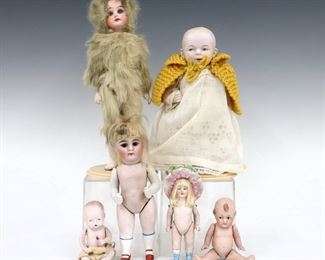 Six antique and vintage Bisque dolls by various makers. Bisque head dolls with painted detail on jointed Bisque and composite bodies, one in attached rabbit fur costume. Some wear and minor damage overall. Up to 9 1/2" long. ESTIMATE $100-150