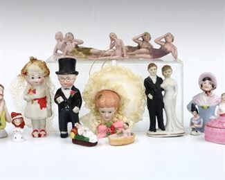Seventeen vintage Bisque and China figures by various makers. Includes half dolls, Hertwig "Bathing Beauty" figures, wedding cake toppers, a trinket box and more. Some wear and minor damage overall. Up to 3" long. ESTIMATE $100-150