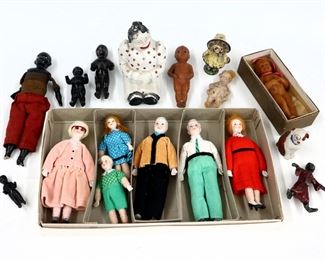Seventeen vintage figures by various makers. Bisque, China, pot metal, composite and wax figures, includes a Shackman Bisque family in the original box. Some wear and minor damage overall. Up to 5 1/2" long. ESTIMATE $100-150