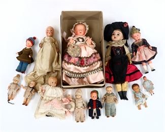 Thirteen antique and vintage Composite dolls by various makers. Includes a French "Gwenaela" doll in the original box. Some wear and minor damage. Up to 9" long. ESTIMATE $50-100