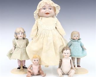 Five antique and vintage dolls by various makers. Includes four full Bisque with painted detail on jointed bodies, and a "Three Faces of Eve" Bisque head doll on a jointed cloth body with Bisque lower limbs. Some with impressed marks. Some wear and minor damage overall. Up to 12" long. ESTIMATE $100-150