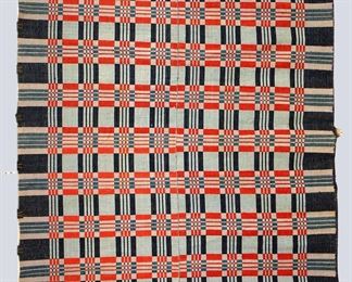An 19th century American Overshot coverlet. Two piece construction with geometric design in three colors of Blue and Red. Wear, minor losses, edge damage to one fringed side. Approx. 71 x 87" long overall. ESTIMATE $100-200