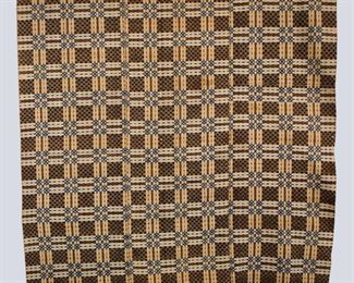 An early 19th century American Overshot coverlet. Three piece construction with geometric design in Dark Brown and Blue. Moderate wear, loss to one corner, staining and minor edge damage. Approx. 81 x 88" long overall. ESTIMATE $100-200