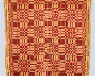 A 19th century American Overshot coverlet. Two piece construction with geometric design in Red and Blue with rounded corners. Some wear and losses. Approx. 79 x 93" long overall. ESTIMATE $100-200