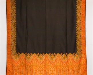 A late 19th century Paisley textile.  Woven multicolor design on a Black field.  Minor edge wear, a few small holes, 4" sewn repair in Black field.  Approx. 60 x 125" high overall.  ESTIMATE $100-200
