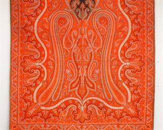 A late 19th century Paisley textile. Woven multicolor design on a Red field. Minor edge wear. Approx. 65 x 132" high overall. ESTIMATE $200-400
