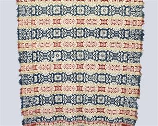 A mid 19th century Jacquard coverlet with corner blocks made by "Isaac Brown" of Ohio in "1847". Two piece construction with floral design in Red, Pink, Blue and Tan. Some wear and losses to fringe, staining particularly to one side, and a few small holes. Approx. 73 x 90" long overall. ESTIMATE $100-200