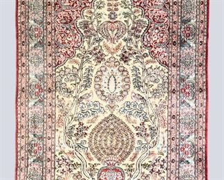 A 3' x 5' vintage Indo-Persian Souf Silk prayer rug. Metallic flat weave and Silk pile, "Tree of Life" design with birds and a floral border on a Red field. Some wear and losses, a few small stains. ESTIMATE $300-500