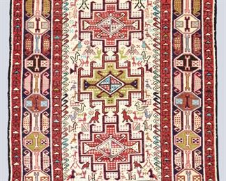 A 2.5 x 3.2' vintage Soumak tapestry or rug. Flat weave, multicolor geometric and animal design with central medallions on an Ivory field. Some wear and pulls, minor losses to edges. ESTIMATE $400-600