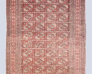 A 3.4 x 5.5' vintage Caucasian rug. Multicolor geometric tribal design on a Red field. Wear and fading, losses to edges and fringe, overall thinning. ESTIMATE $100-200