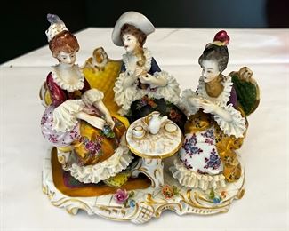#17. $70. Lot of (4): German Porcelain Figure and Box, French Porcelain Children Figure & Gilt Ruby Decanter (chipped at rim).