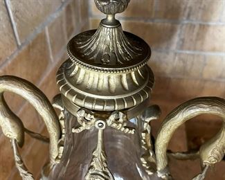 #29. $900. Pair of Baccarat gilt/glass Urns, 22"Hx10.5"x8", and wood bases, 12"x12"x9H.