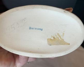 #17. $70. Lot of (4): German Porcelain Figure and Box, French Porcelain Children Figure & Gilt Ruby Decanter (chipped at rim).