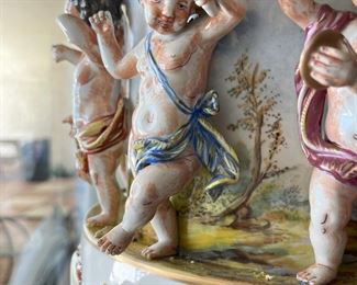 #60- $1,800 Monumental Pair of Capodimonte Covered Figural Urns, 30"Hx13"W. One finial is damaged...we have the pieces to be glued.