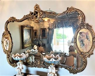 #102- $275 Rococo Gilded Mirror, with molded figures on each side. 76x48 