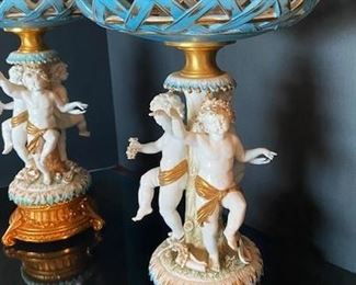 #103- $400 Pair of Italian Porcelain Tazzas with cupids around stem, signed Tiche, 18"Hx12"
