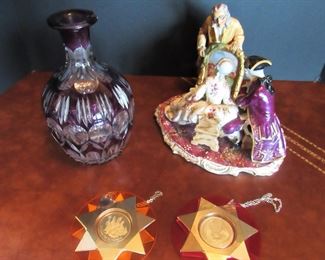 #105- $50 Decorative Lot: Amethyst Decanter (chip at neck), Porcelain Figurine (damage at bottom), & (2) Vintage Ornaments.