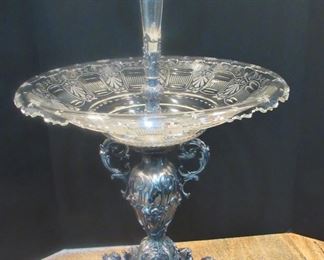 #107- $1000 19th century Silver Plated Epergne with trumpet vase and glass center, flanked by two putti and shell cups. 2'w X 32T