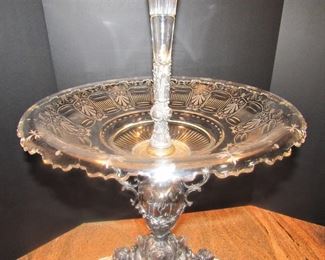 #107- $1000 19th century Silver Plated Epergne with trumpet vase and glass center, flanked by two putti and shell cups.2'w X 32T