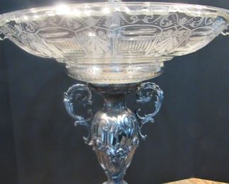 #107- $1000 19th century Silver Plated Epergne with trumpet vase and glass center, flanked by two putti and shell cups. 2'w X 32T