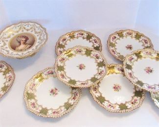 Lot 114 - $120 dessert set made of French figural cake stand & 8 Staffordshire plates gold rim, green, floral