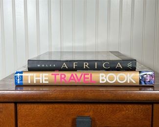 (2PC) [SIGNED] COFFEE TABLE BOOKS | Including Africa by Art Wolfe, signed by the author; and Lonely Planet The Travel Book, with dedication. - w. 14.75 x h. 11.25 in (largest)