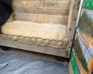 WOOD LOVESEAT WITH IRON WHEELS 
