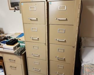 2 very tall file cabinets