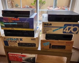 Vintage vhs recorders with original boxes and remotes