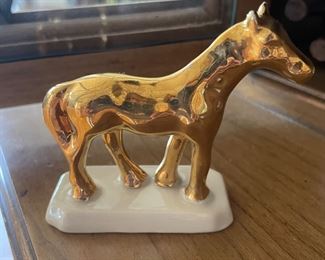 Small gold horse figure,  $5