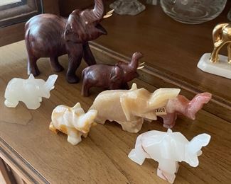 Pair of wooden carved elephants,  $10.   Set of 5 onyx  elephants,  $10