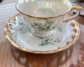 Iridescent whit & gold floral teacup.  $8
