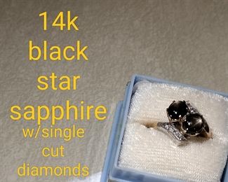 14K BLACK STAR SAPPHIRE WITH SINGLE DIAMONDS