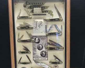 Lot # : 101 - Case Family Brands Series Display & Knives 1of 250
Crandall Cutlery Co. was started by the son-in-law of W.R. Case, Herbert Crandall, and merged his company with Russ Case's company W.R. Case & Son around 1911 thus creating the company we know as W.R. Case & Sons. To honor the merger Case has released a collector's series - Case Family Brands. The Crandall Cutlery Co Set includes 10 knives with Crandall Cutlery classic jigged green bone handles, Crandall Cutlery bowtie shield, Crandall Cutlery logo is on a Surgical Steel blade with long tail C consecutive serialization. Set includes Seahorse Whittler 6355WHSS, Medium Congress 64052 SS, Medium Toothpick 610094 SS, Medium Stockman 6318 SS, Peanut 6220 SS, Half Whittler 6208 SS, Large Coke 61050 SS, Tuxedo 62156 SS, Trapper 6254 SS, Small Gunstock 6215 SS