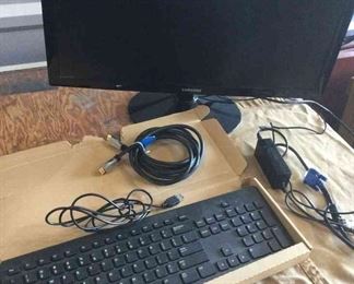 Samsung Computer Screen Monitor, Two Speakers, And Dell Keyboard