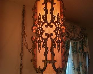 The hanging light is approximately 2' long. In great condition.