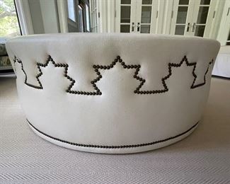 Leather Upholstered Ottoman with Decorative Nailhead Trim. Measures 50" D x 18" H. Photo 2 of 3.